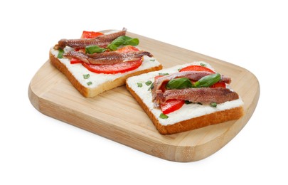 Photo of Delicious sandwiches with cream cheese, anchovies, tomatoes and basil on white background