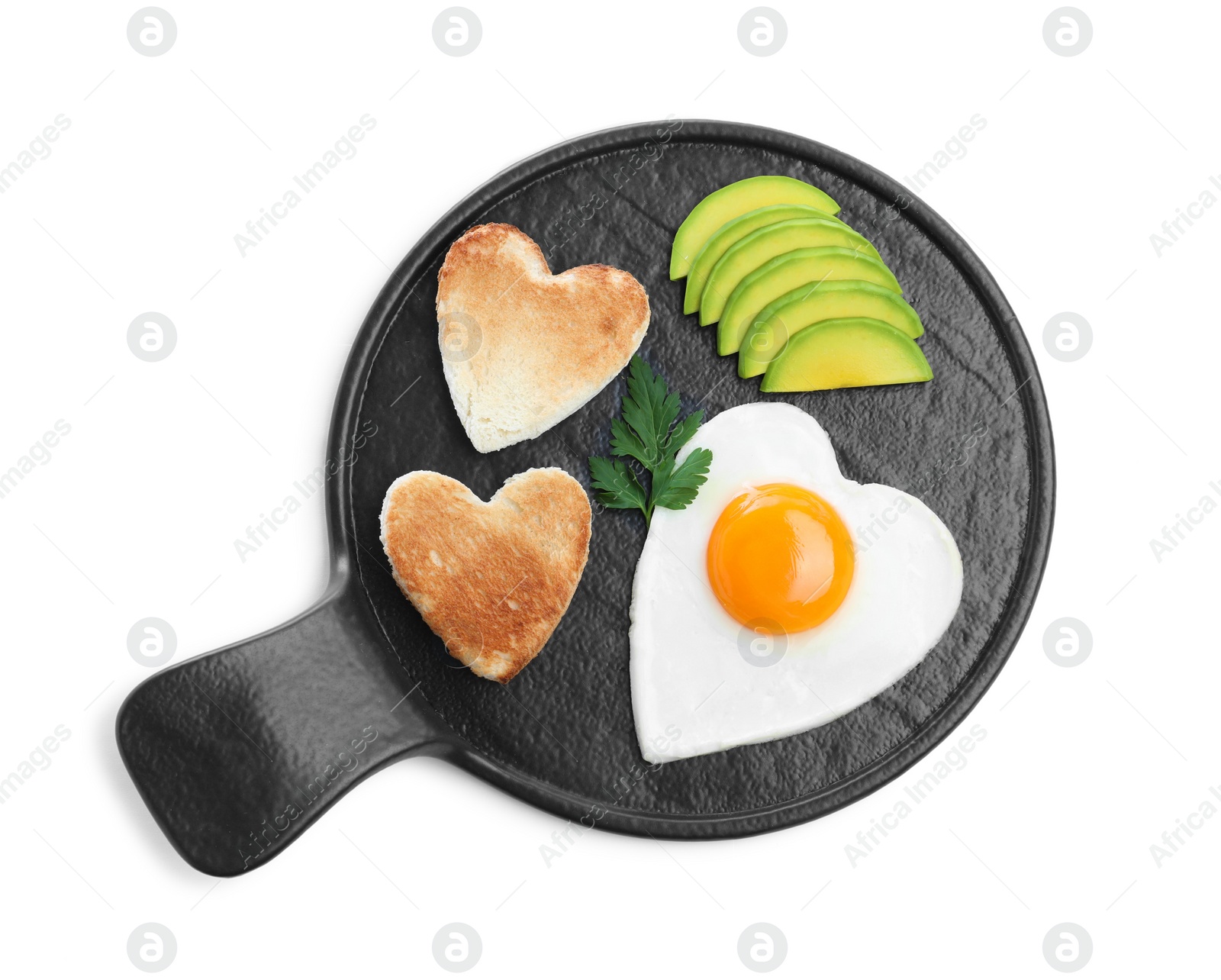 Photo of Romantic breakfast with fried heart shaped egg, avocado and toasts isolated on white, top view. Valentine's day celebration