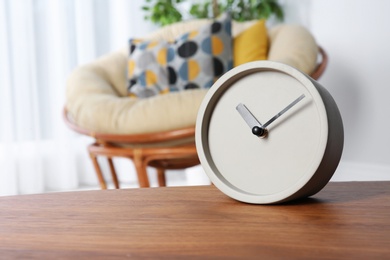 Photo of Analog clock on table indoors, space for text. Time management
