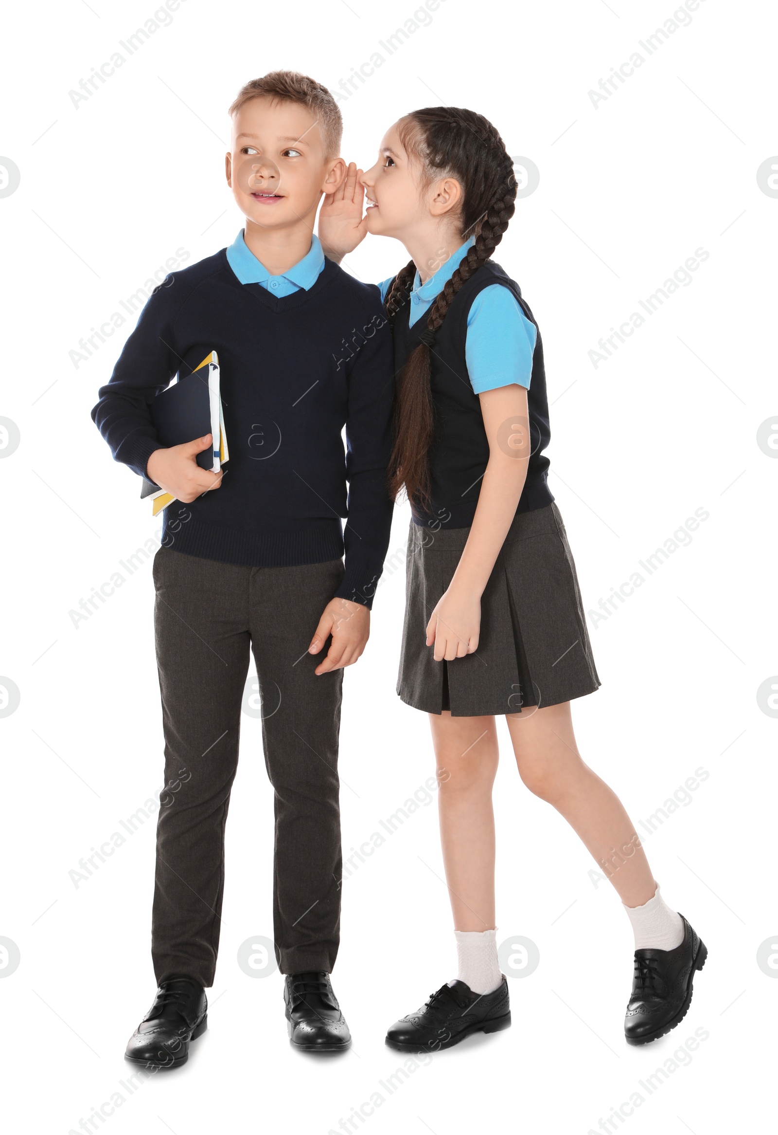 Photo of Full length portrait of cute children in school uniform on white background