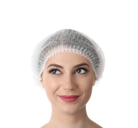 Young medical student in surgical cap on white background