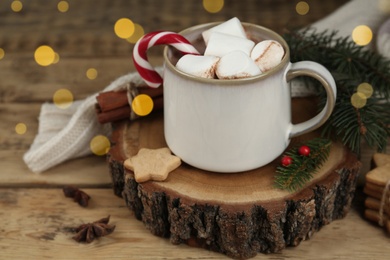 Photo of Composition with delicious marshmallow cocoa on wooden table