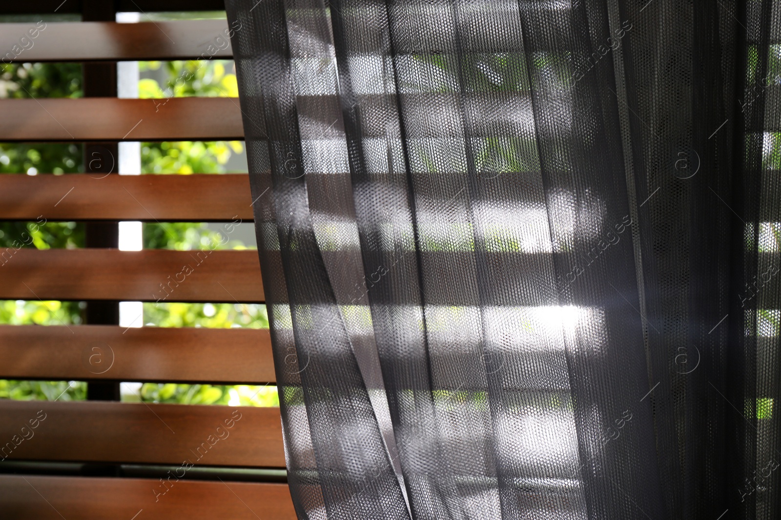 Photo of Window with beautiful curtain and blinds, closeup