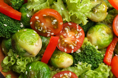 Photo of Tasty salad with Brussels sprouts, top view