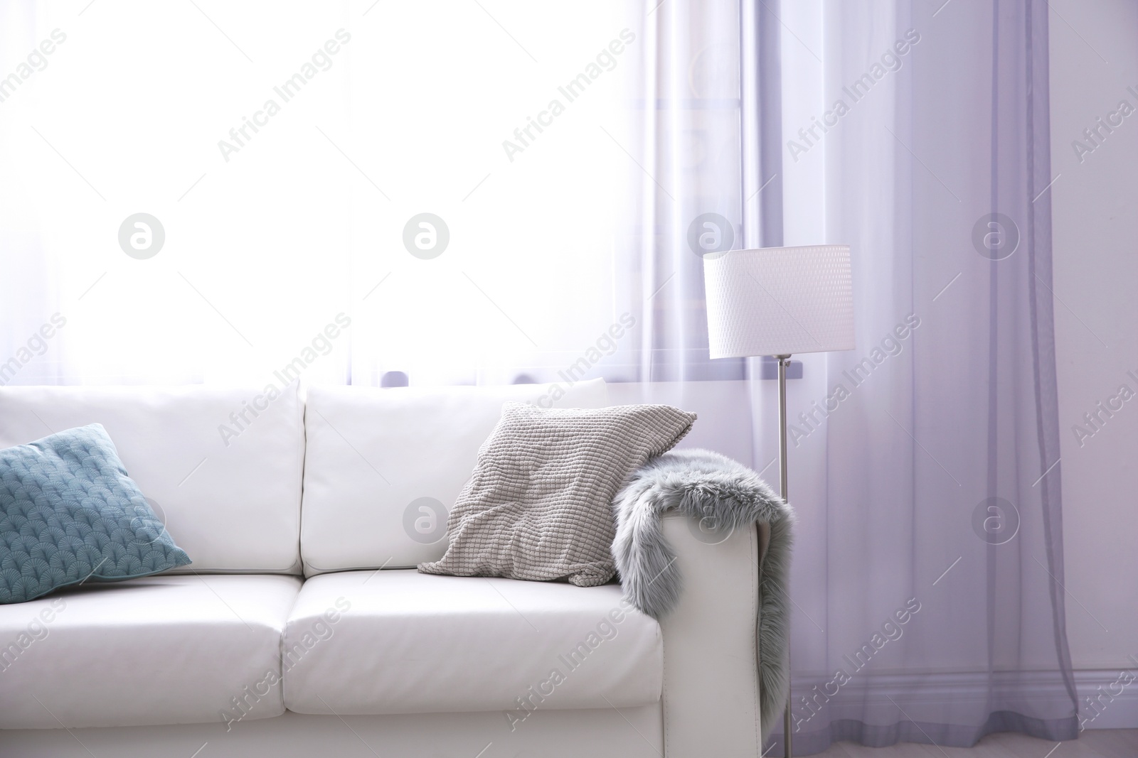 Photo of Modern living room interior with comfortable sofa. Space for text