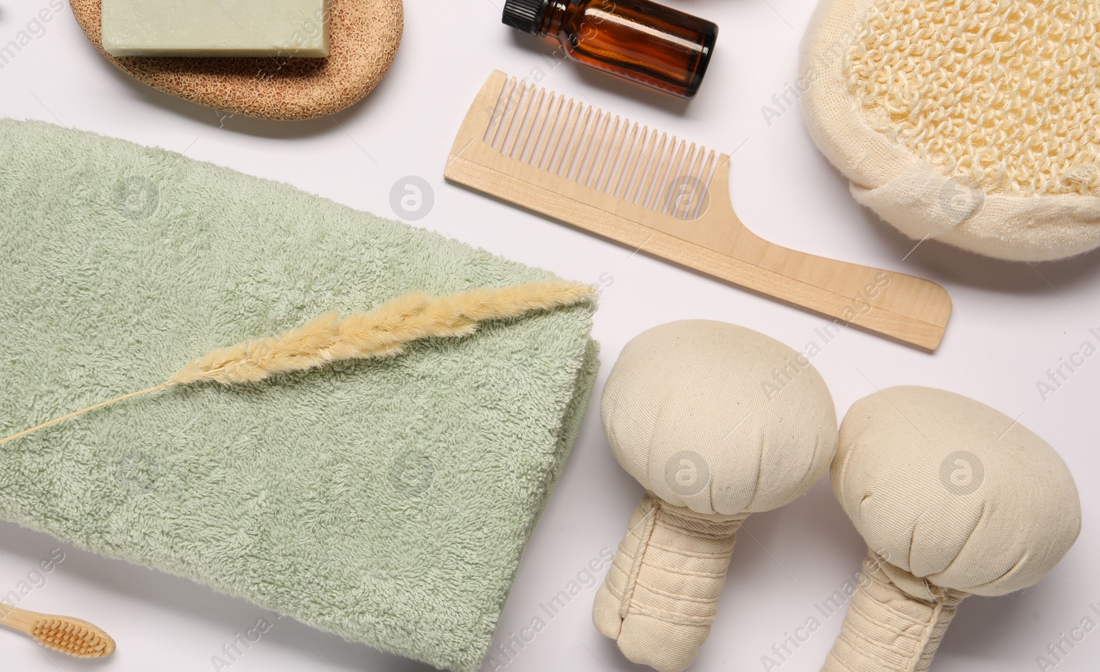 Photo of Bath accessories. Different personal care products and dry spikelet on white background, flat lay