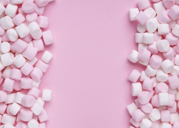 Photo of Delicious marshmallows on pink background, flat lay. Space for text