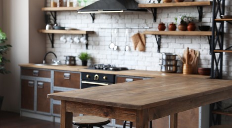 Image of Empty wooden table in beautiful kitchen. Banner design