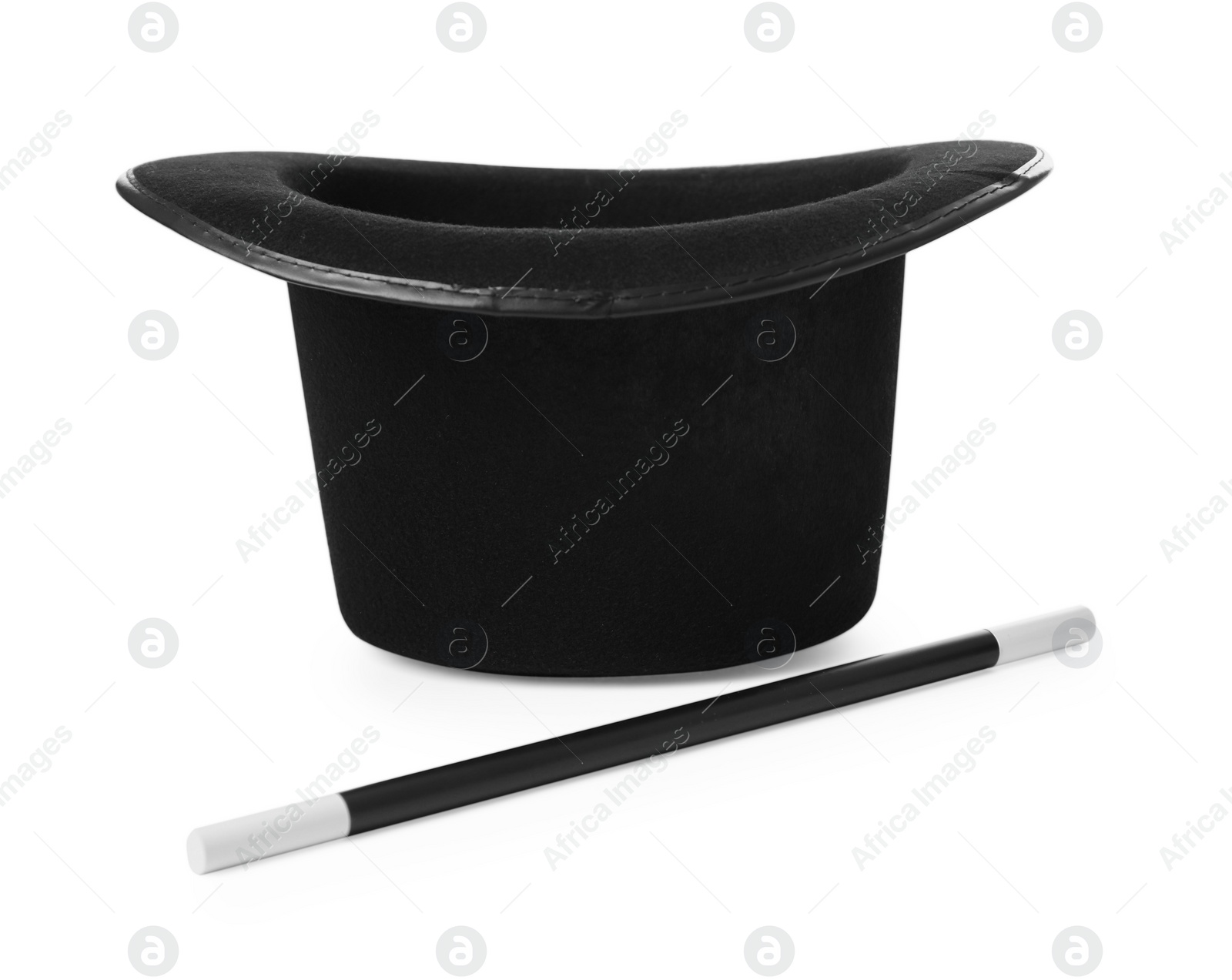 Photo of Black top hat and wand isolated on white. Magician equipment