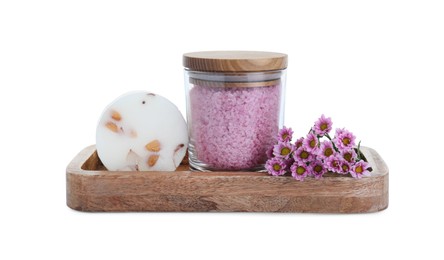 Photo of Glass container of pink sea salt, natural soap and beautiful chrysanthemum flowers isolated on white