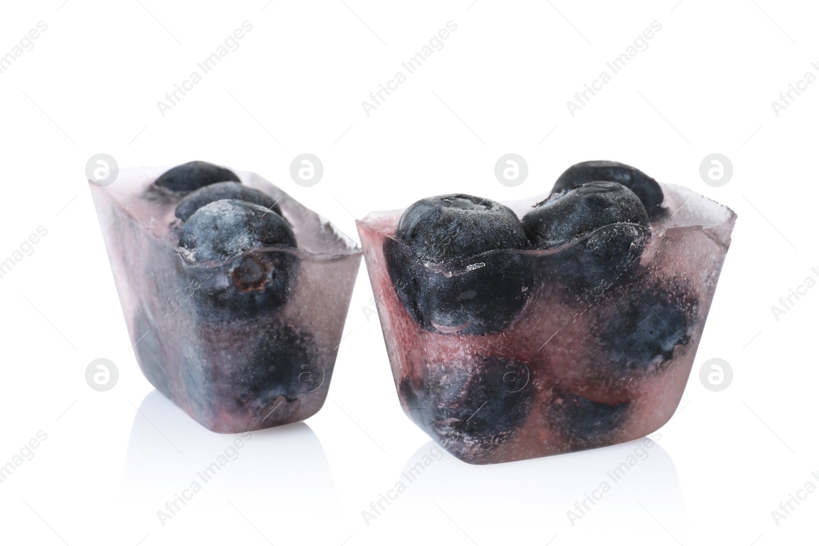 Photo of Ice cubes with blueberries on white background