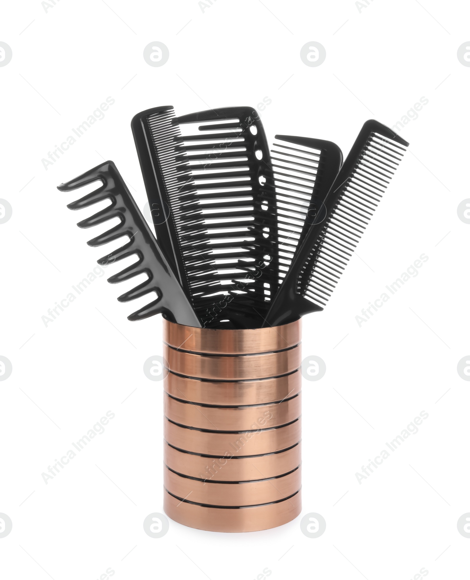 Photo of Set of professional hair combs in holder isolated on white