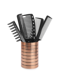 Photo of Set of professional hair combs in holder isolated on white