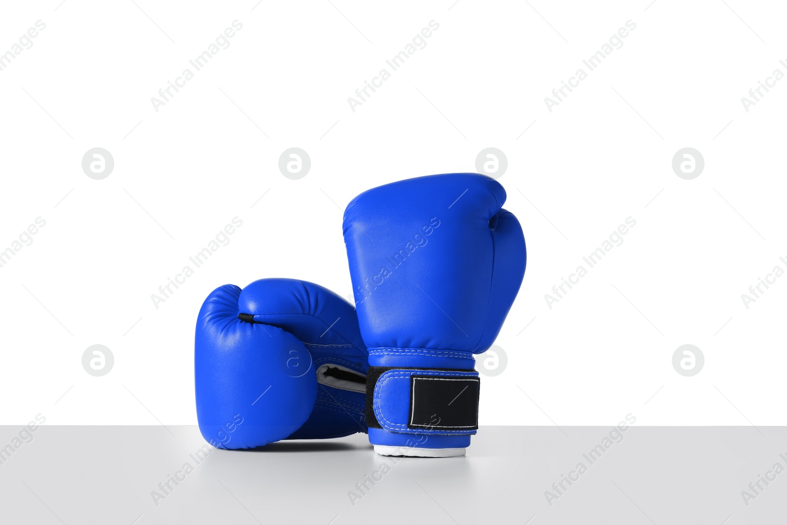 Image of Pair of blue boxing gloves isolated on white