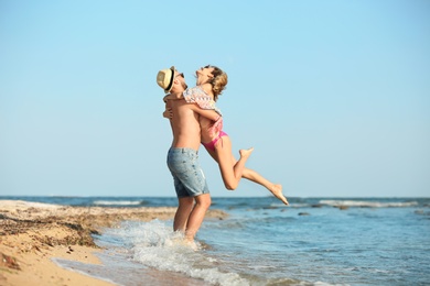 Young couple spending time together on beach