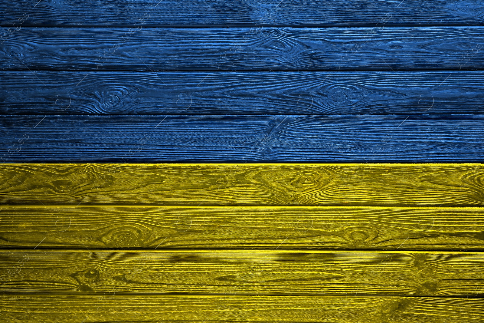 Image of National flag of Ukraine painted on wooden surface