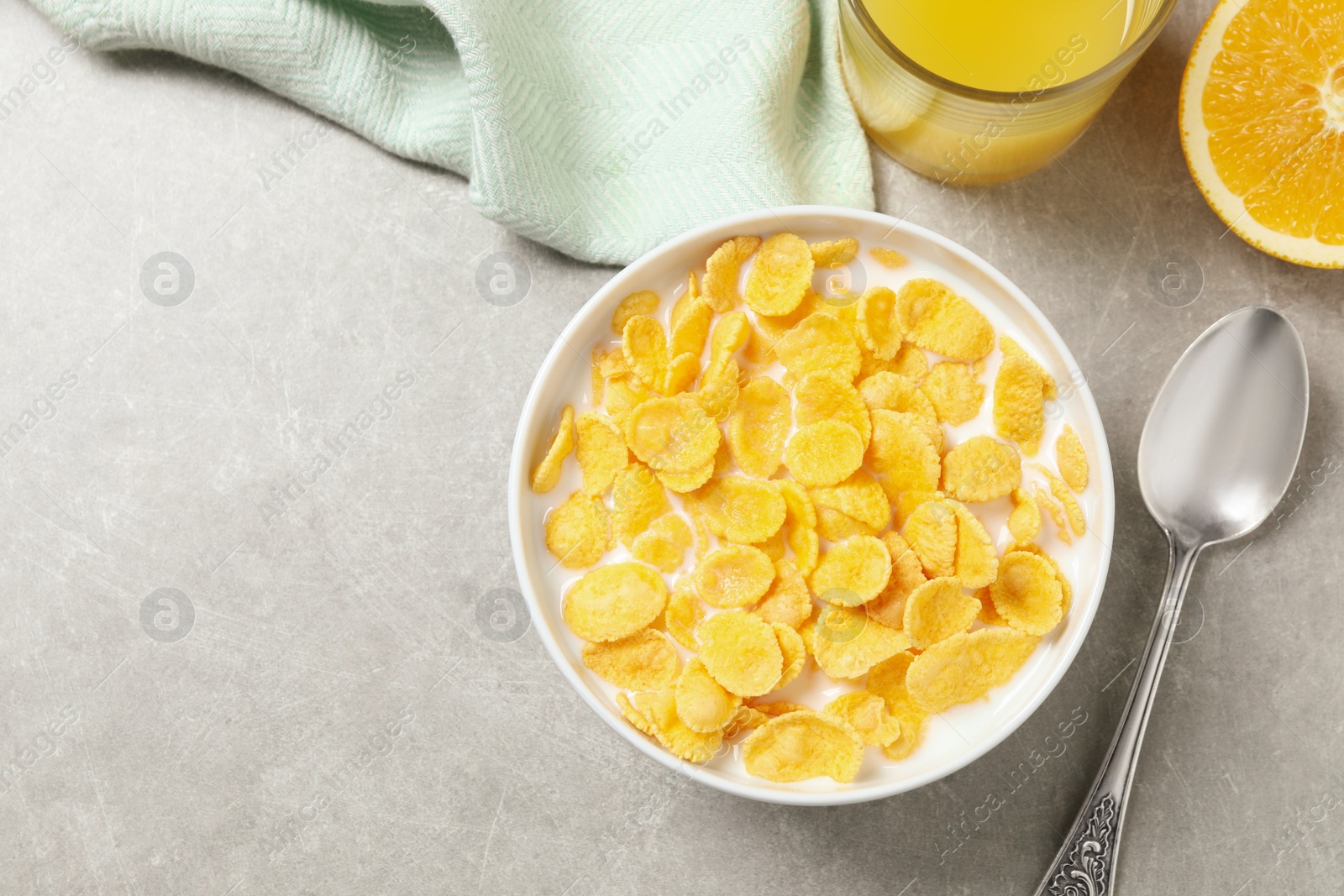 Photo of Flat lay composition with tasty corn flakes on light grey table