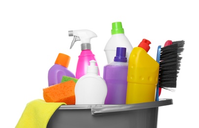 Photo of Bucket with different cleaning products and tools on white background