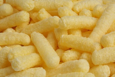 Tasty sweet corn sticks as background, closeup