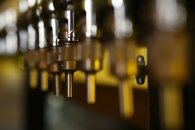 New modern beer taps in pub, closeup. Professional bar equipment