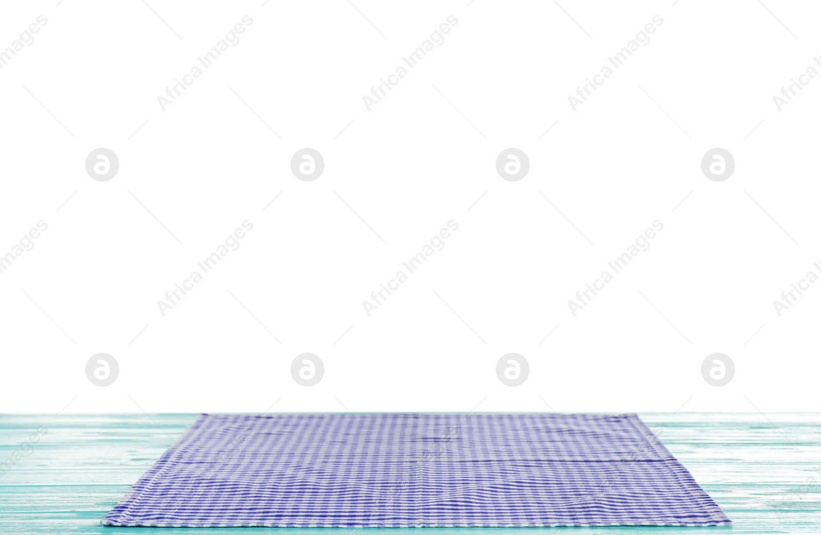 Photo of Checkered napkin on table against white background