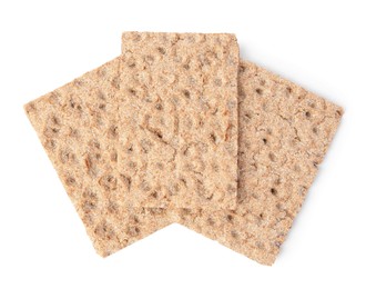 Fresh crunchy crispbreads on white background, top view