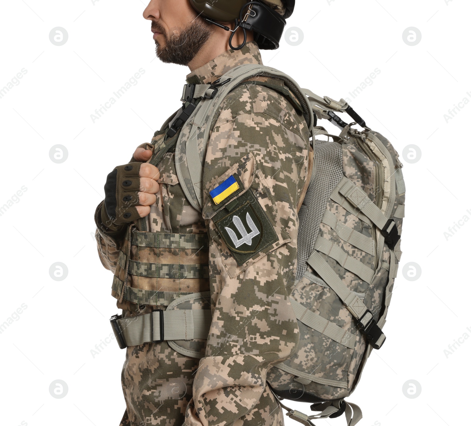 Photo of Soldier with Ukrainian flag and trident on military uniform against white background, closeup