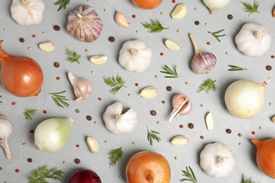 Photo of Flat lay composition with garlic and onion on table