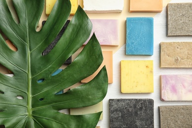 Flat lay composition with handmade soap bars on color background