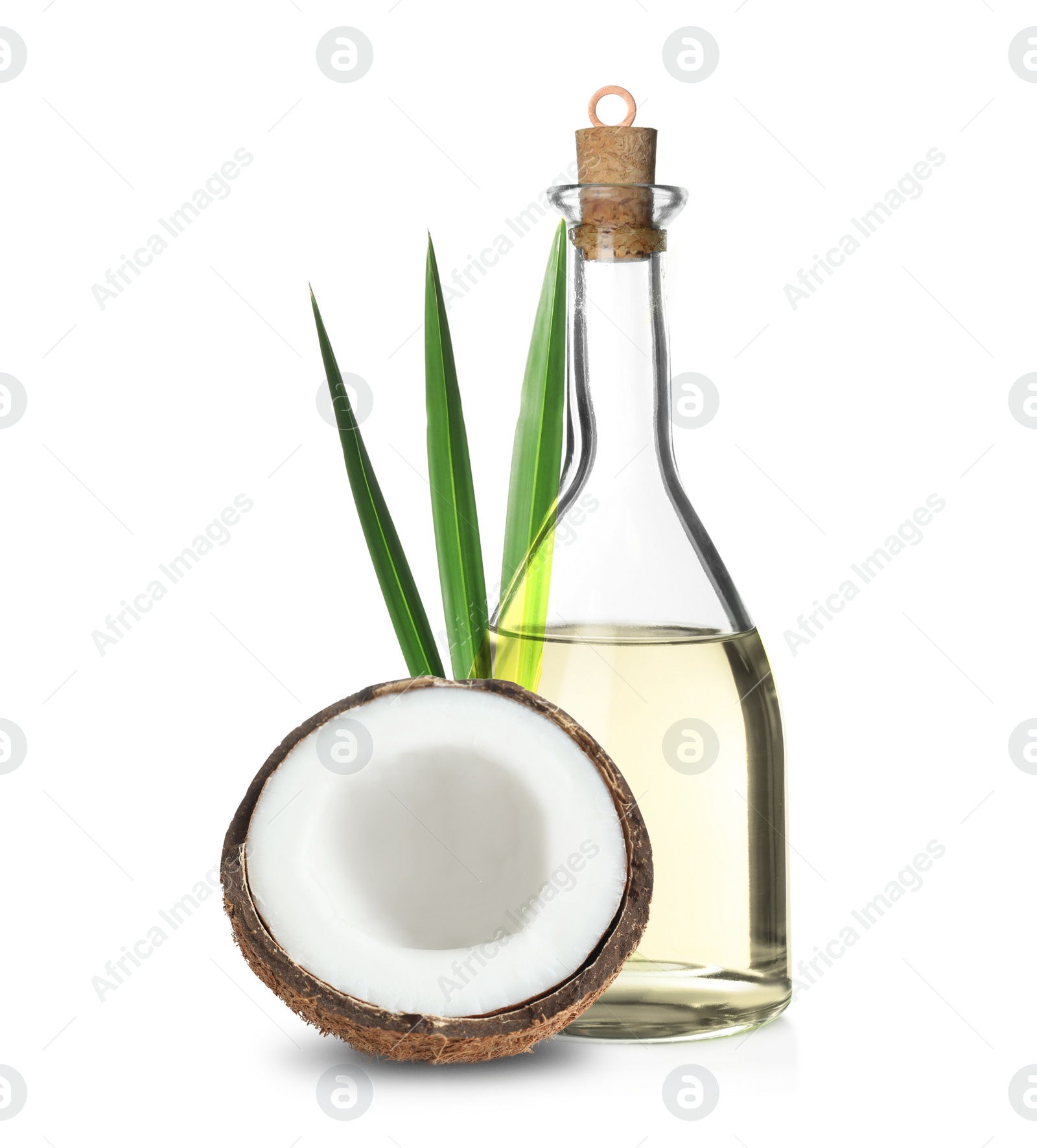 Image of Bottle of coconut cooking oil and fruit on white background