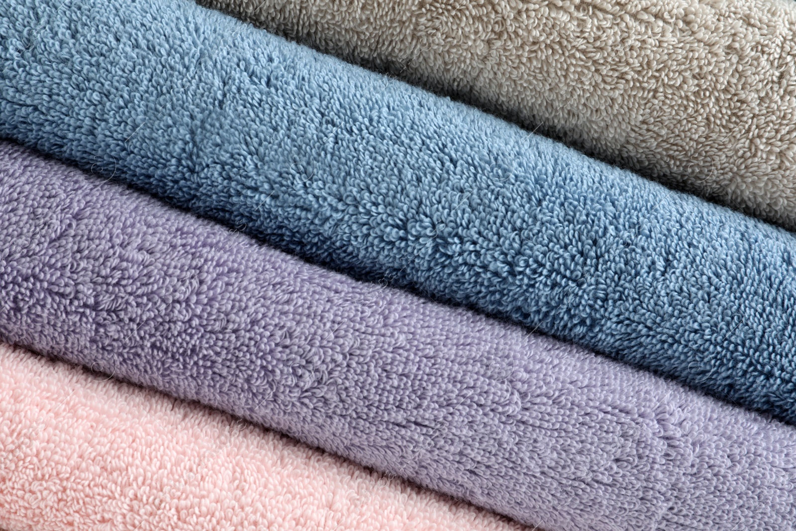 Photo of Stack of clean terry towels as background