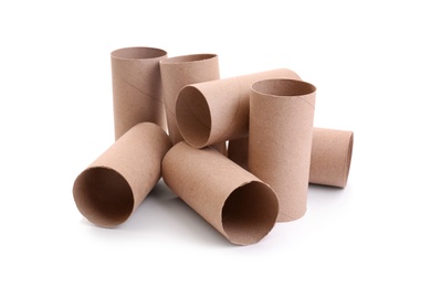 Photo of Empty paper toilet rolls on white background