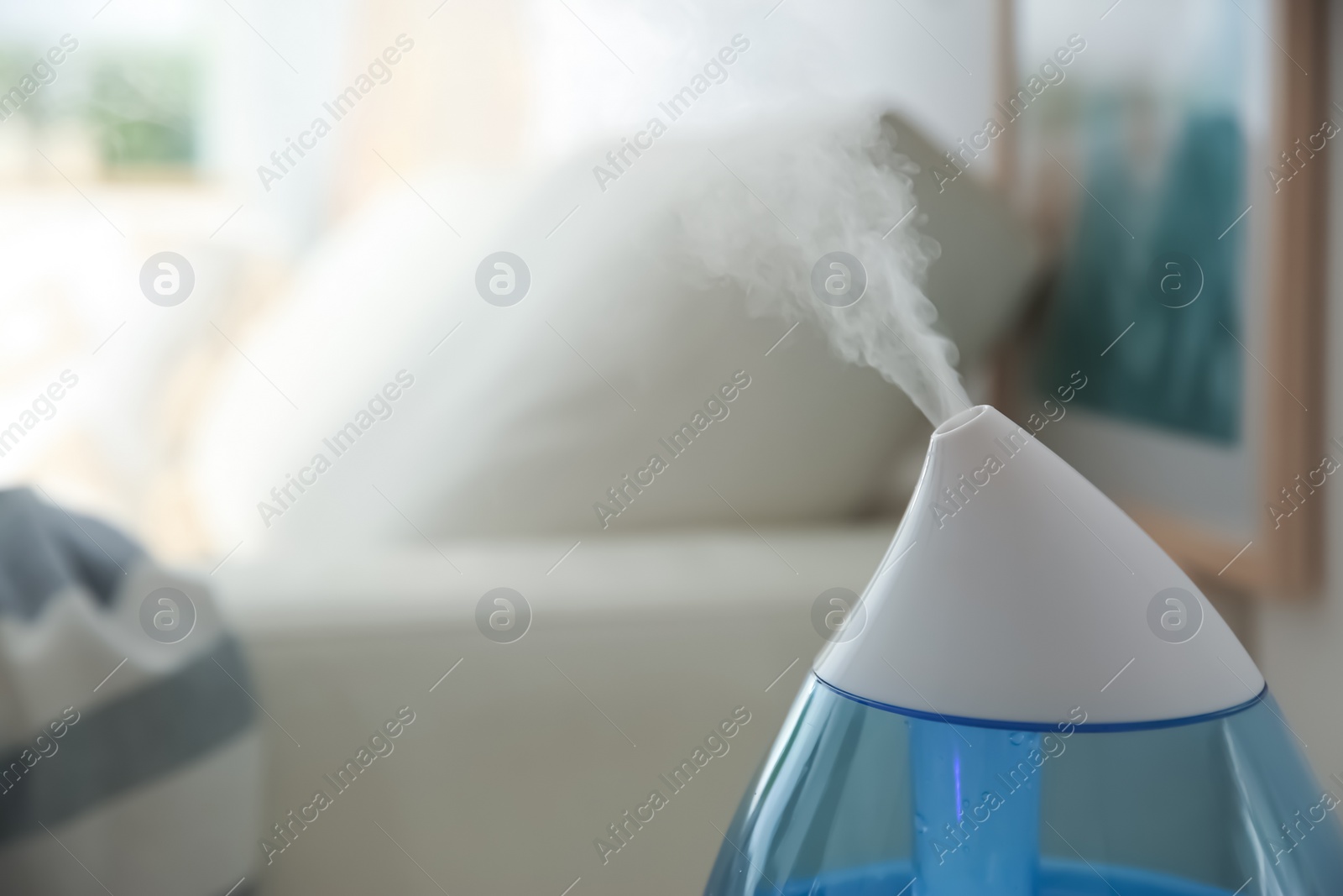 Photo of Modern humidifier indoors, closeup. Space for text