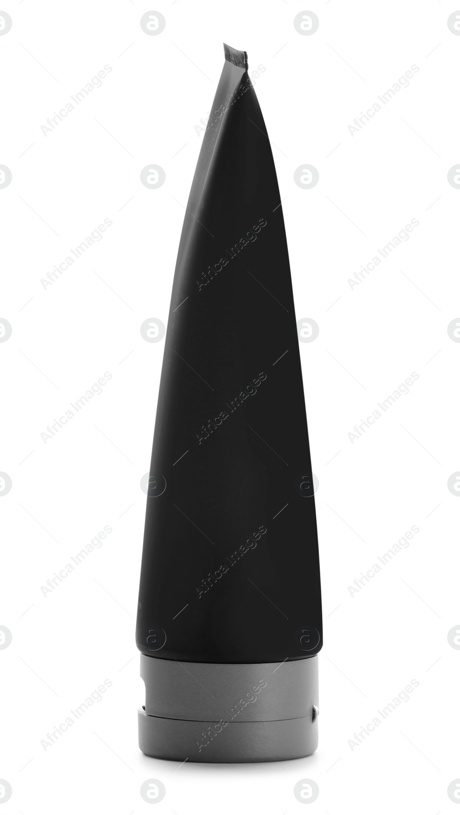 Photo of Black tube against white background. Cosmetic product for men