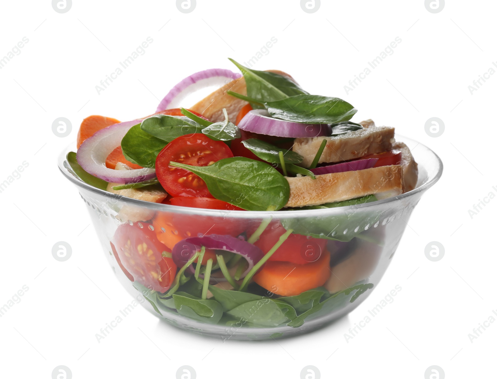 Photo of Delicious salad with chicken, vegetables and spinach in glass bowl isolated on white