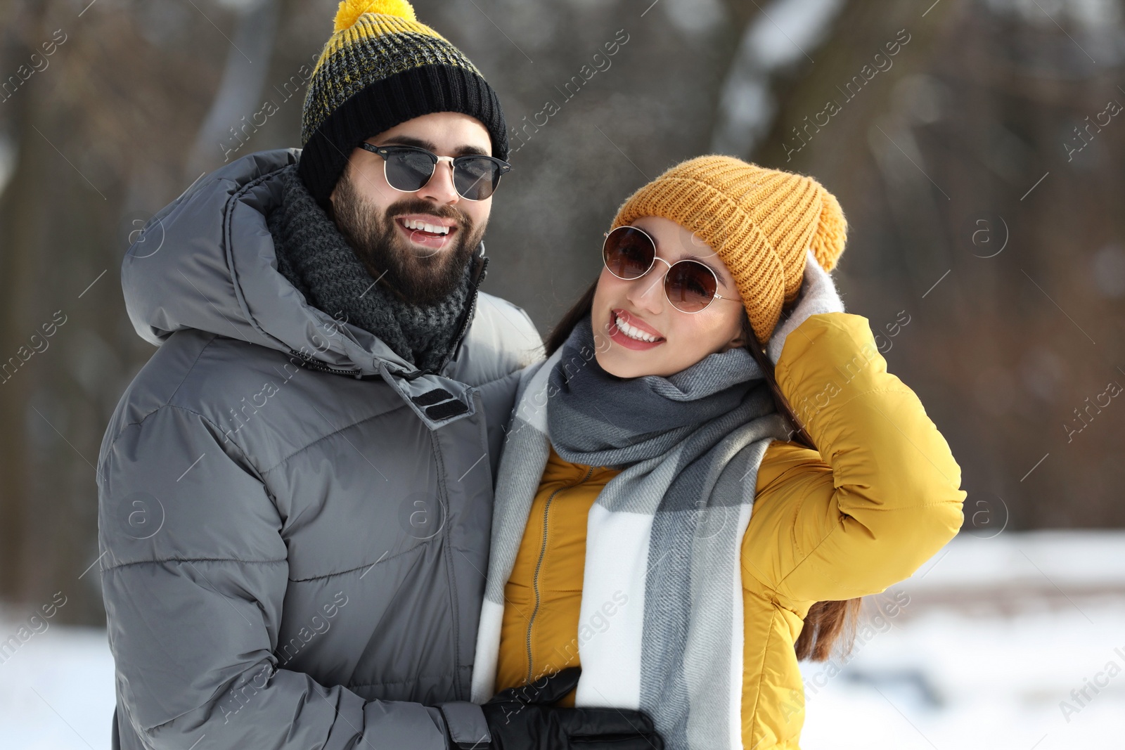 Photo of Beautiful happy couple outdoors on winter day