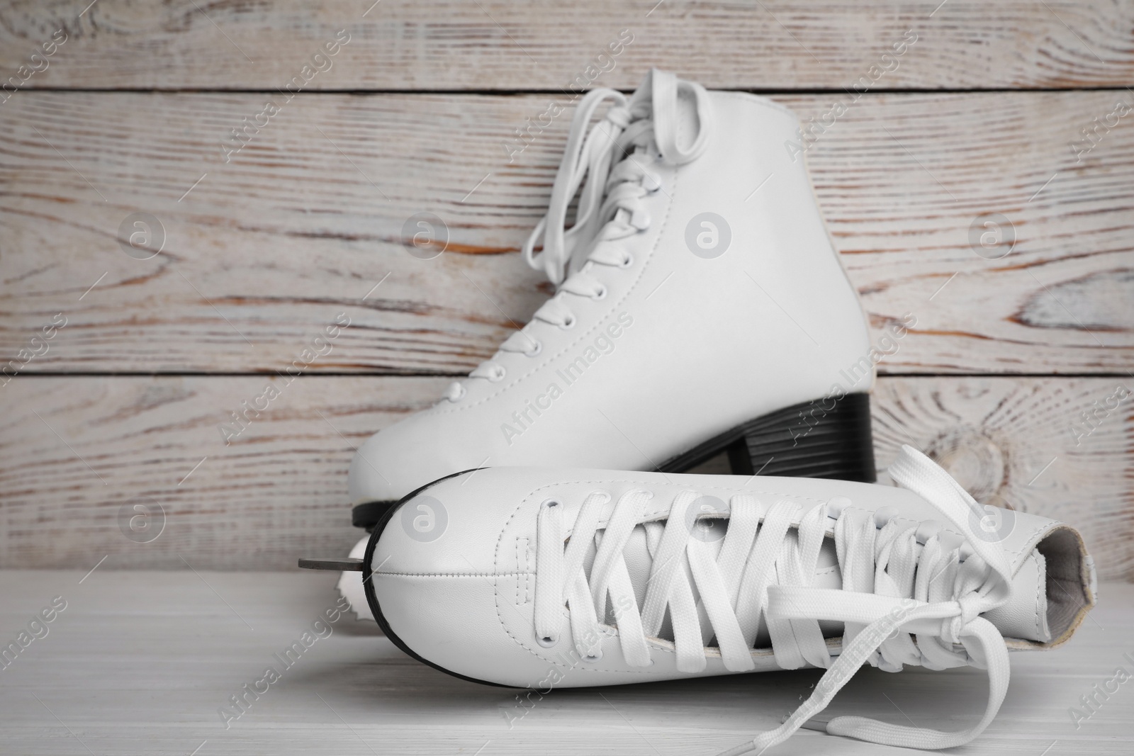 Photo of Pair of ice skates on white wooden table