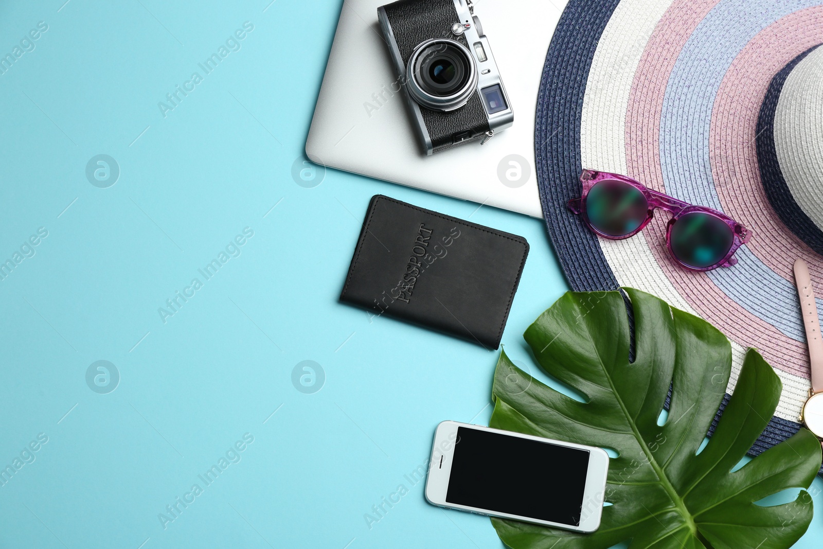 Photo of Flat lay composition with accessories, devices and space for text on color background. Travel blogger