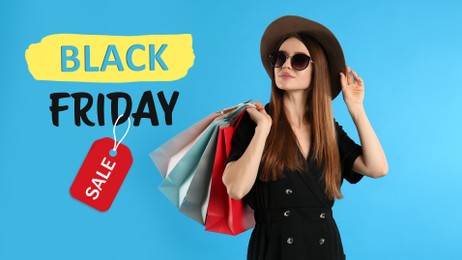 Image of Black Friday Sale. Beautiful young woman with shopping bags on light blue background