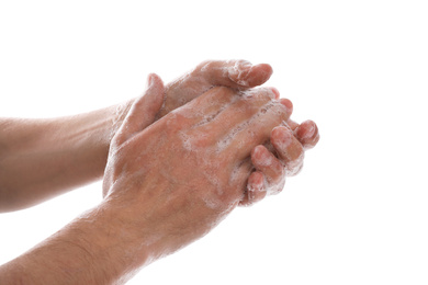 Man washing hands with soap on white background, closeup