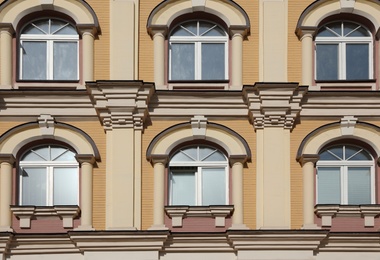 Photo of Wall of vintage building with beautiful windows