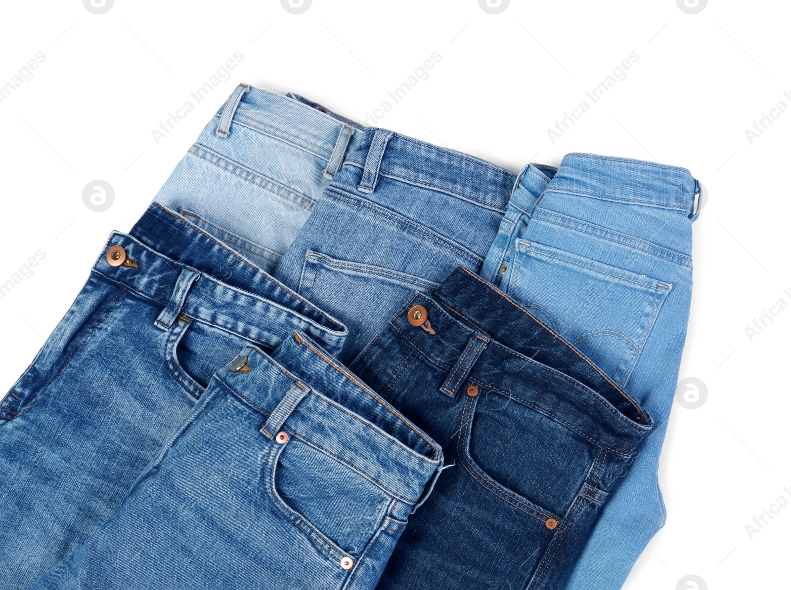 Photo of Different stylish jeans isolated on white, top view