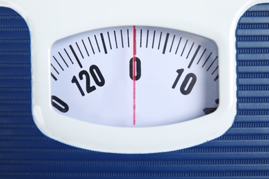 Photo of Modern scales, closeup view. Diet and weight loss