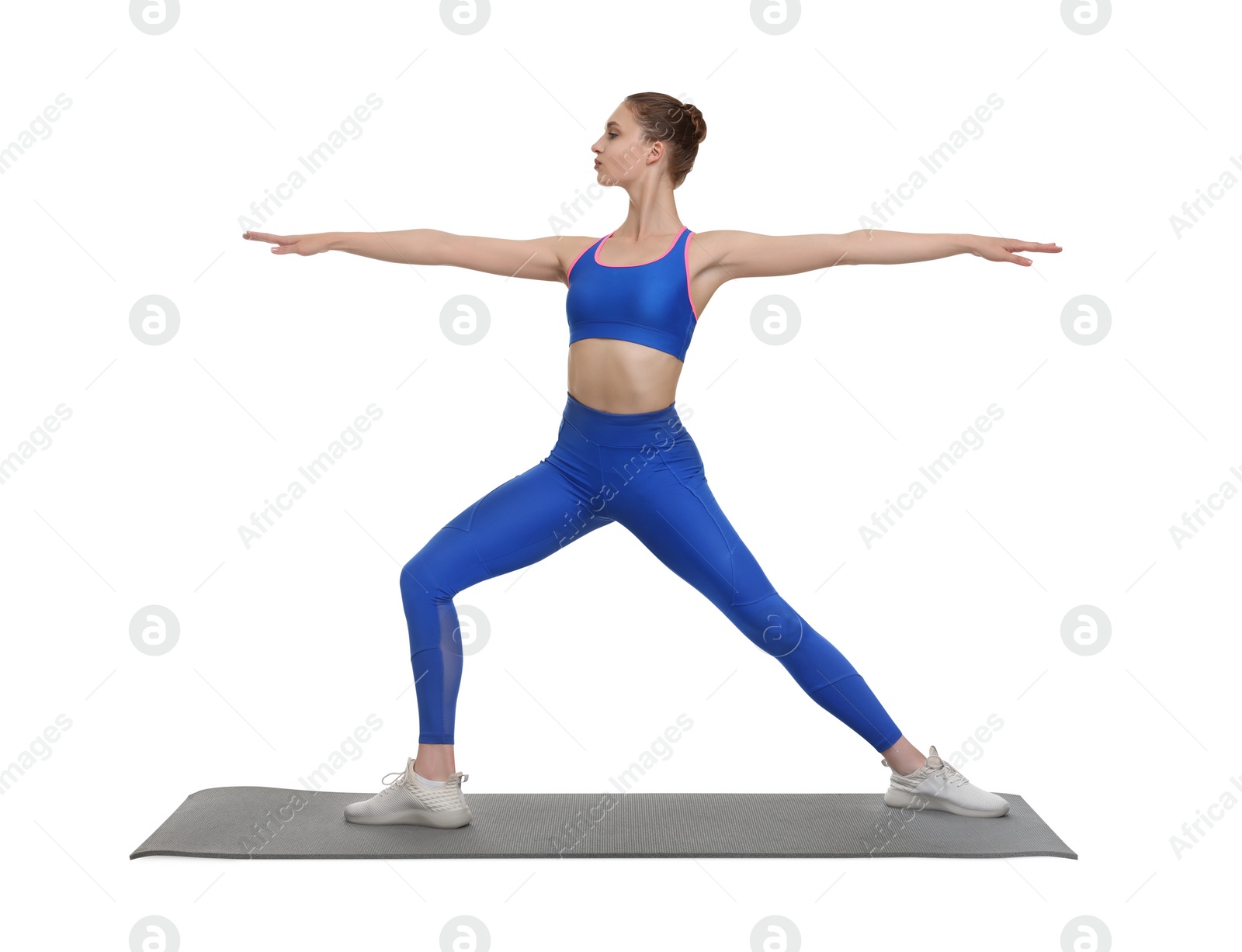 Photo of Young woman practicing yoga on white background