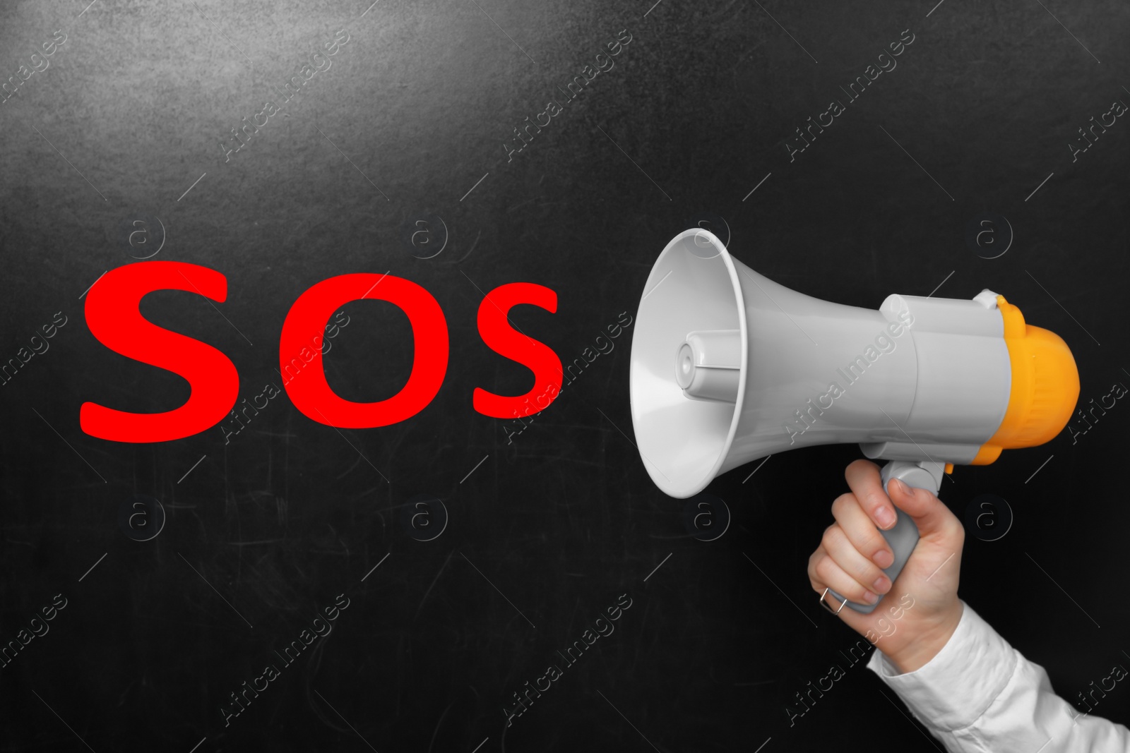 Image of Man holding megaphone and word SOS near chalkboard. Asking for help