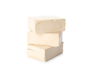 Photo of Blocks of compressed yeast on white background