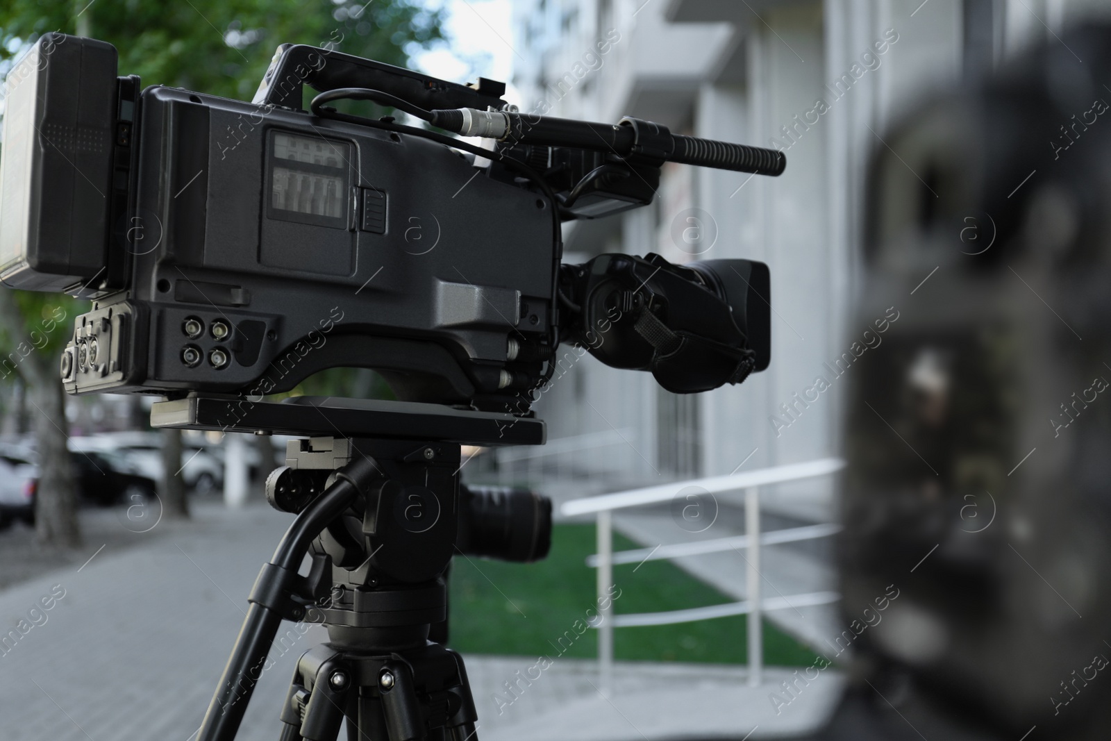 Photo of Modern video cameras outdoors. Professional media equipment