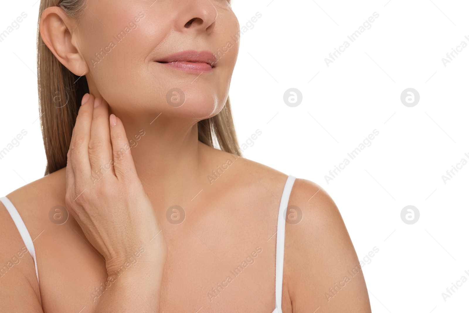 Photo of Mature woman touching her neck on white background, closeup