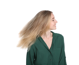 Portrait of beautiful young woman with blonde hair on white background