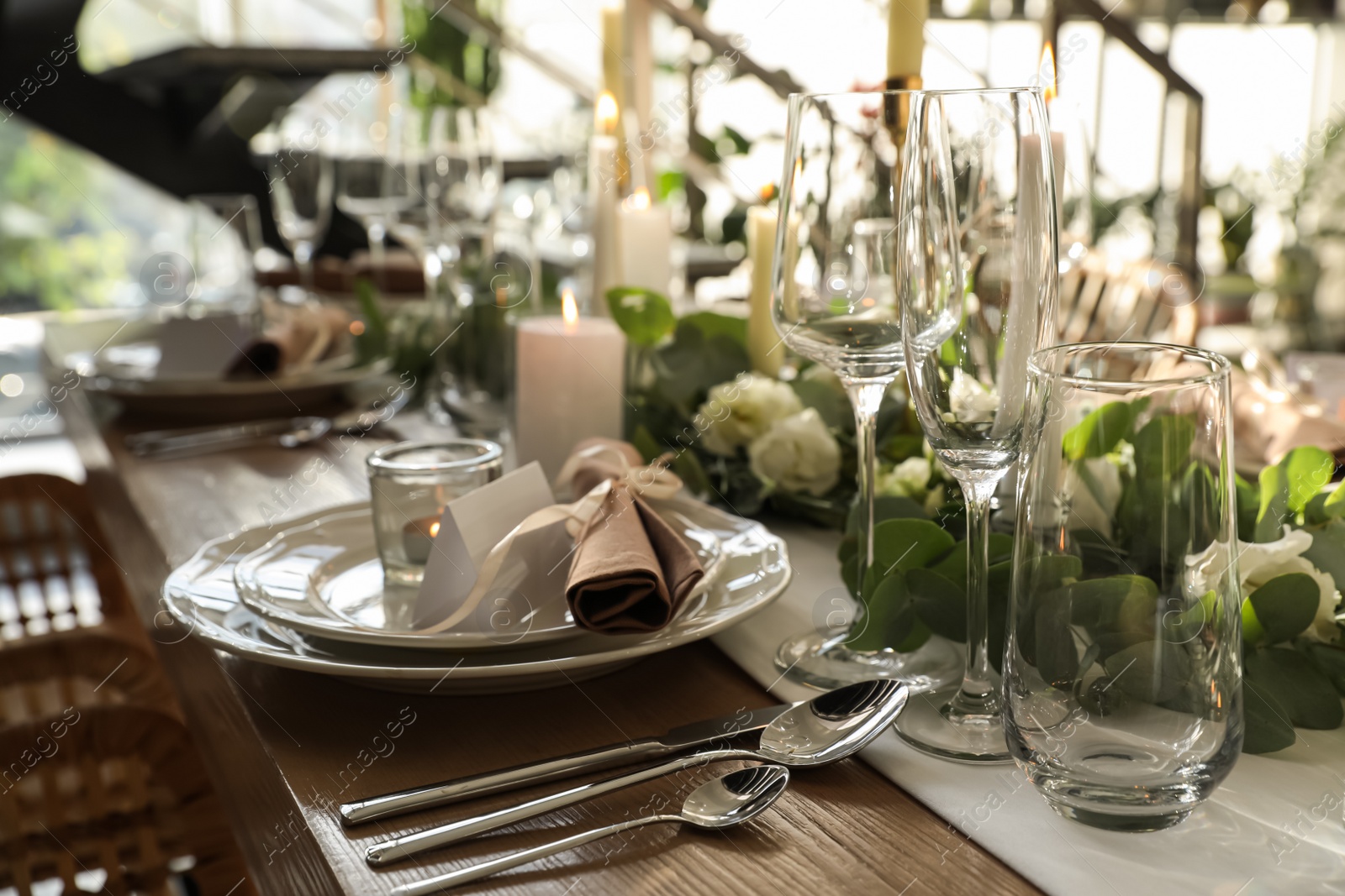 Photo of Elegant table setting with beautiful floral decor